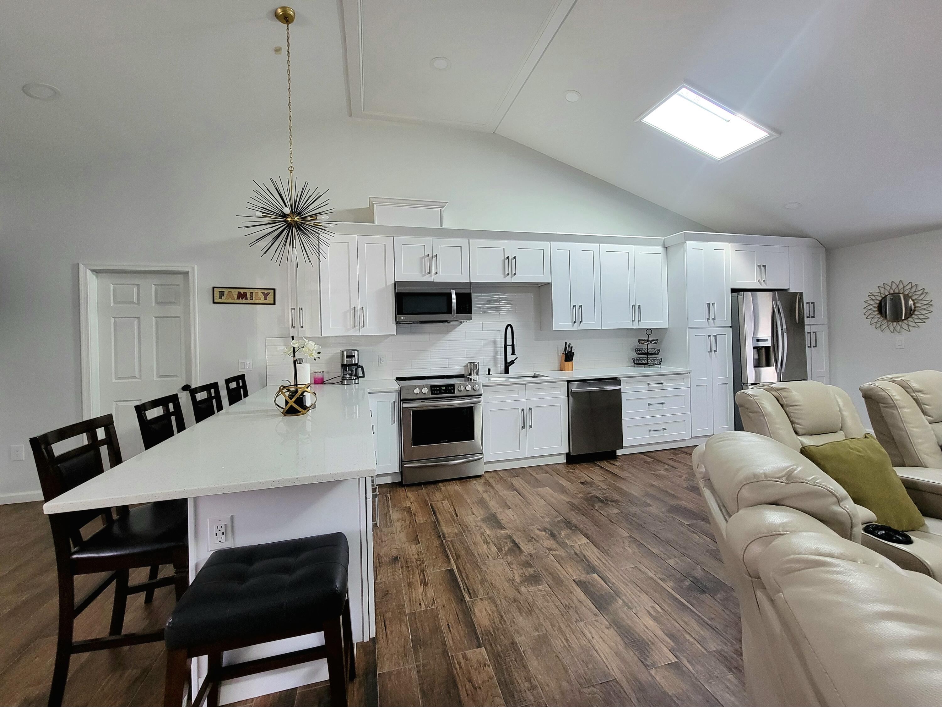6395 Cherokee Trail Tobyhanna, PA 18466 - Photo 10 of 48 a living room with furniture and kitchen view