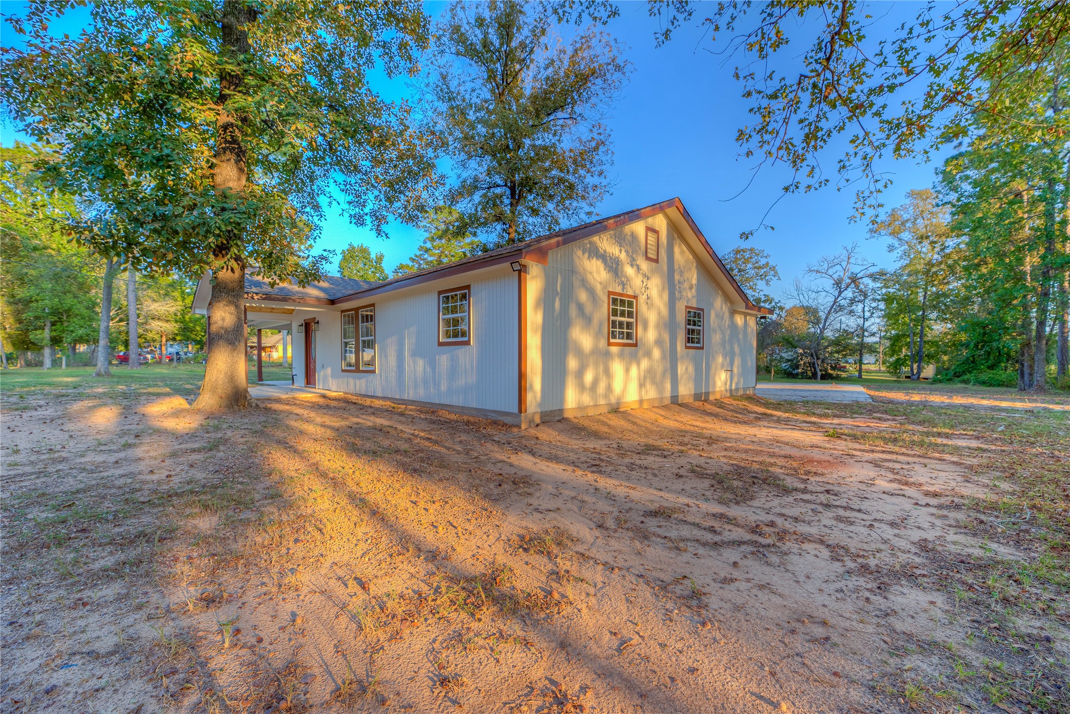 388 Sunrise Wood Road Goodrich, TX 77335 - Photo 23 of 33 a view of a house with backyard and a tree
