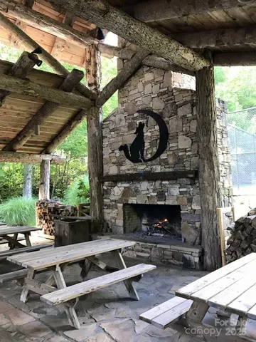 a front view of a house with swing table and chairs