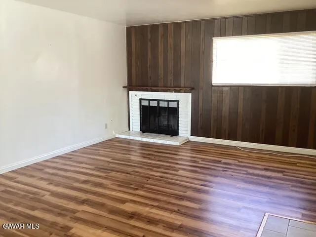 a view of a fireplace in an empty room