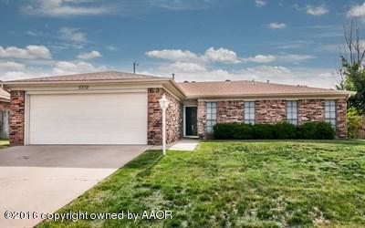 5312 Wheeler Lane Amarillo, TX 79110 - Photo 1 of 20 a front view of a house with a yard and garage