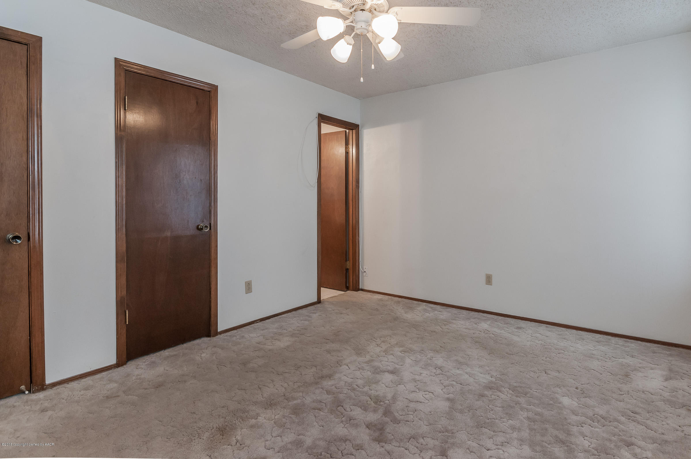 5312 Wheeler Lane Amarillo, TX 79110 - Photo 12 of 20 an empty room with chandelier fan