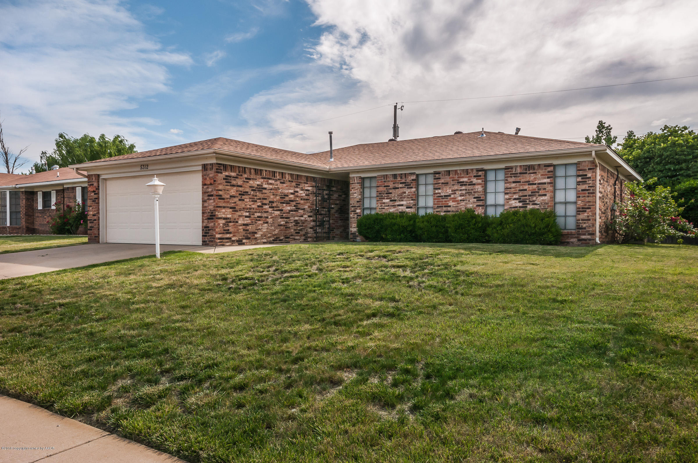 5312 Wheeler Lane Amarillo, TX 79110 - Photo 20 of 20 a view of a house with a yard