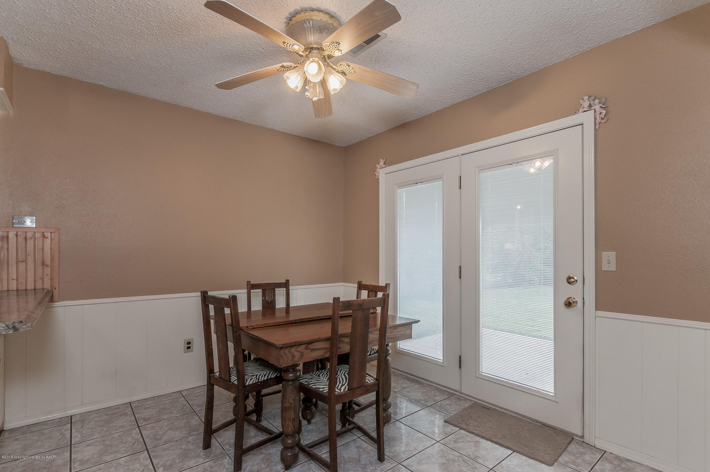5312 Wheeler Lane Amarillo, TX 79110 - Photo 6 of 20 a view of a dining room with furniture and chandelier fan