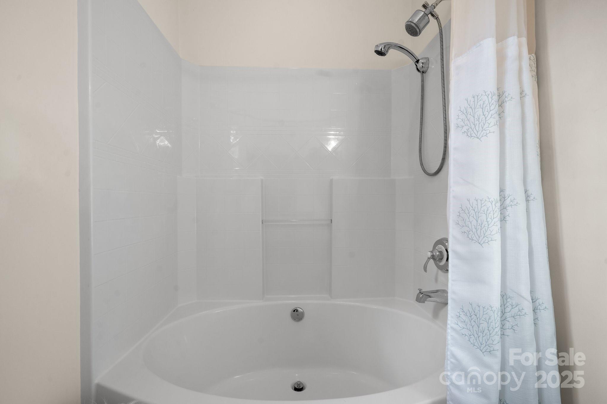 4530 Meandering Way Conover, NC 28613 - Photo 24 of 48 a bathroom with a bath tub and shower