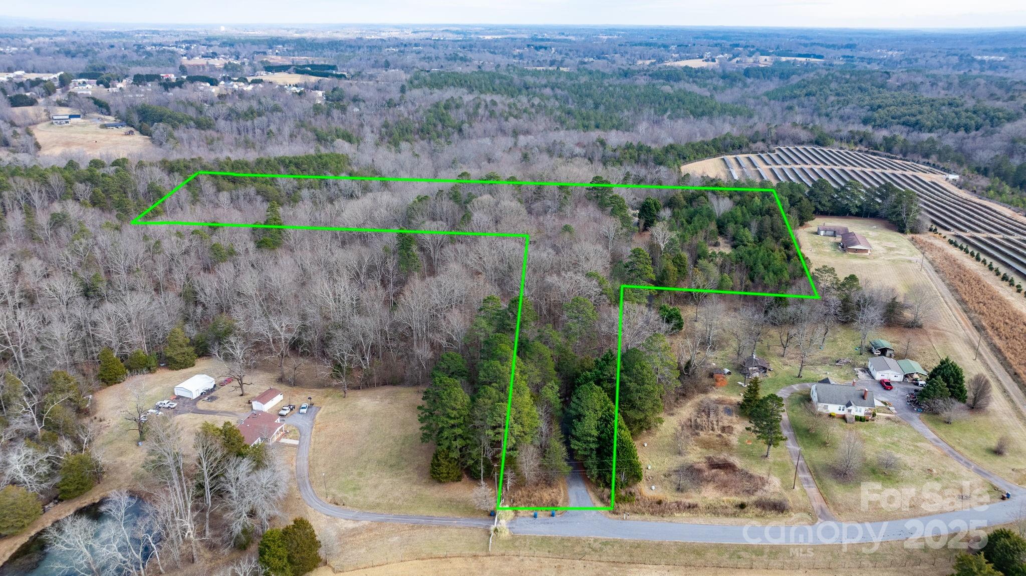 4530 Meandering Way Conover, NC 28613 - Photo 3 of 48 an aerial view of a house with a yard and lake view