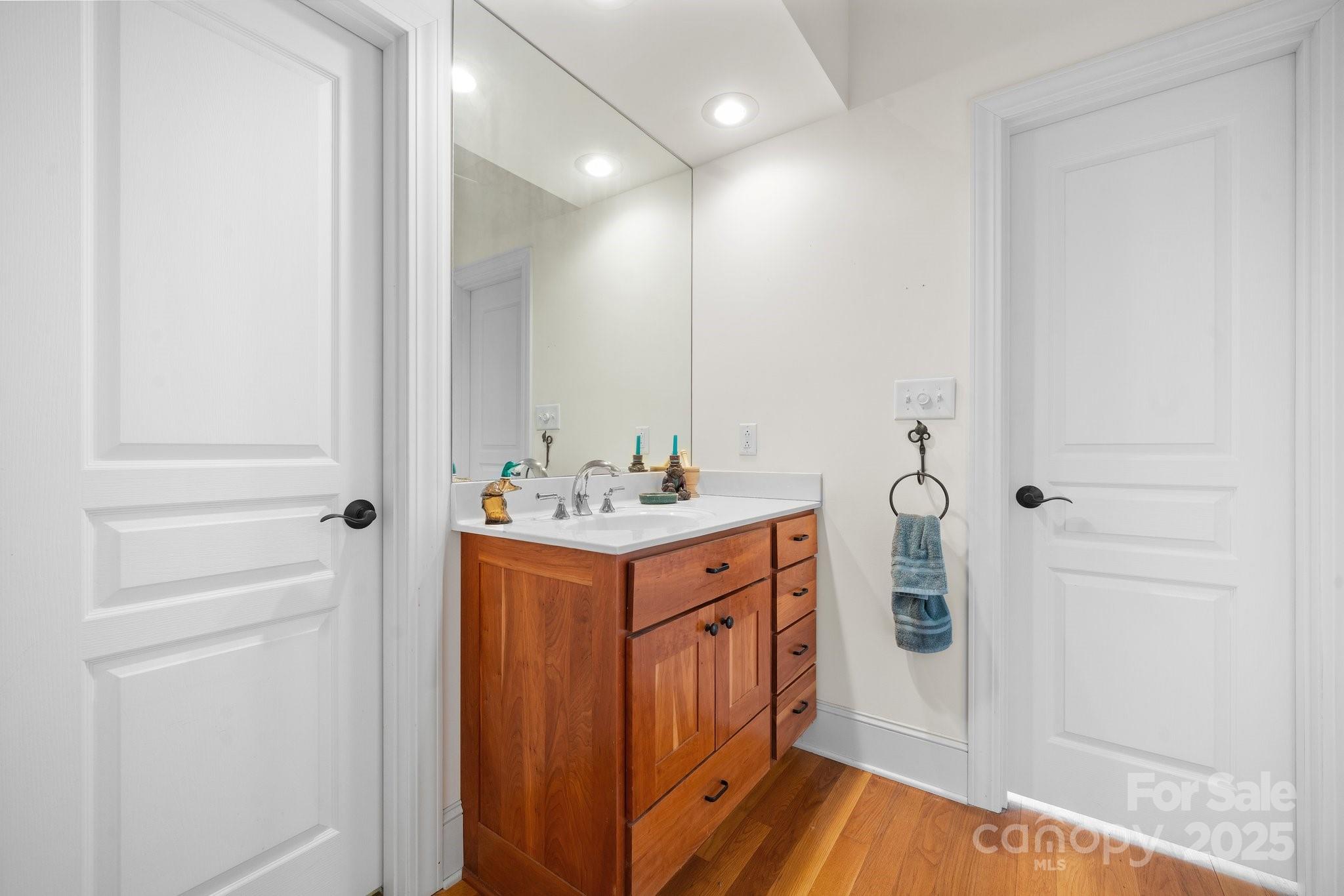 4530 Meandering Way Conover, NC 28613 - Photo 31 of 48 a bathroom with a sink a mirror and shower