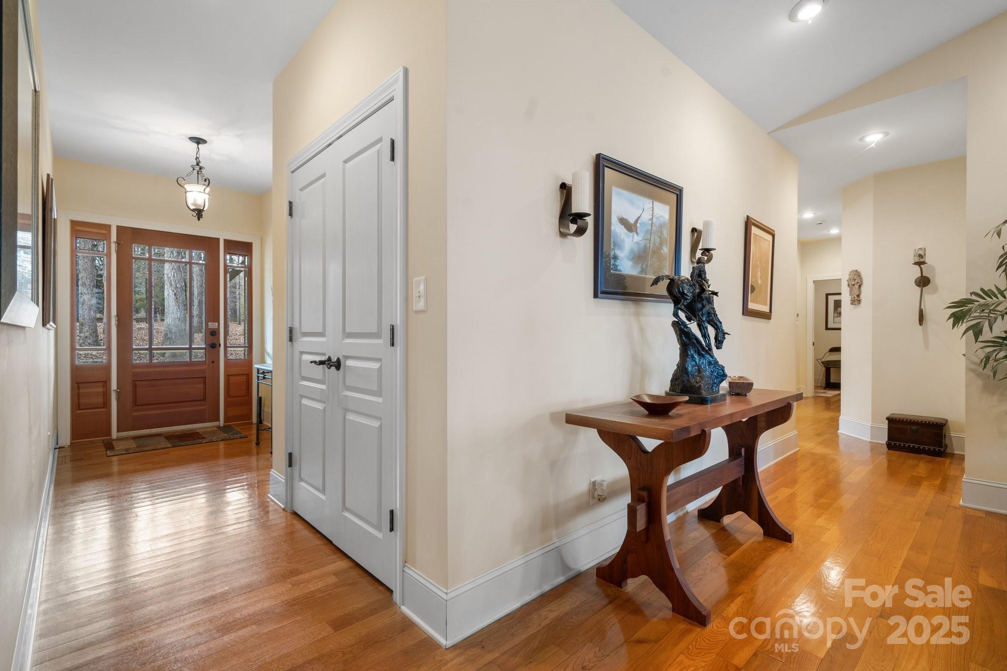 4530 Meandering Way Conover, NC 28613 - Photo 8 of 48 a view of a hallway with wooden floor and furniture
