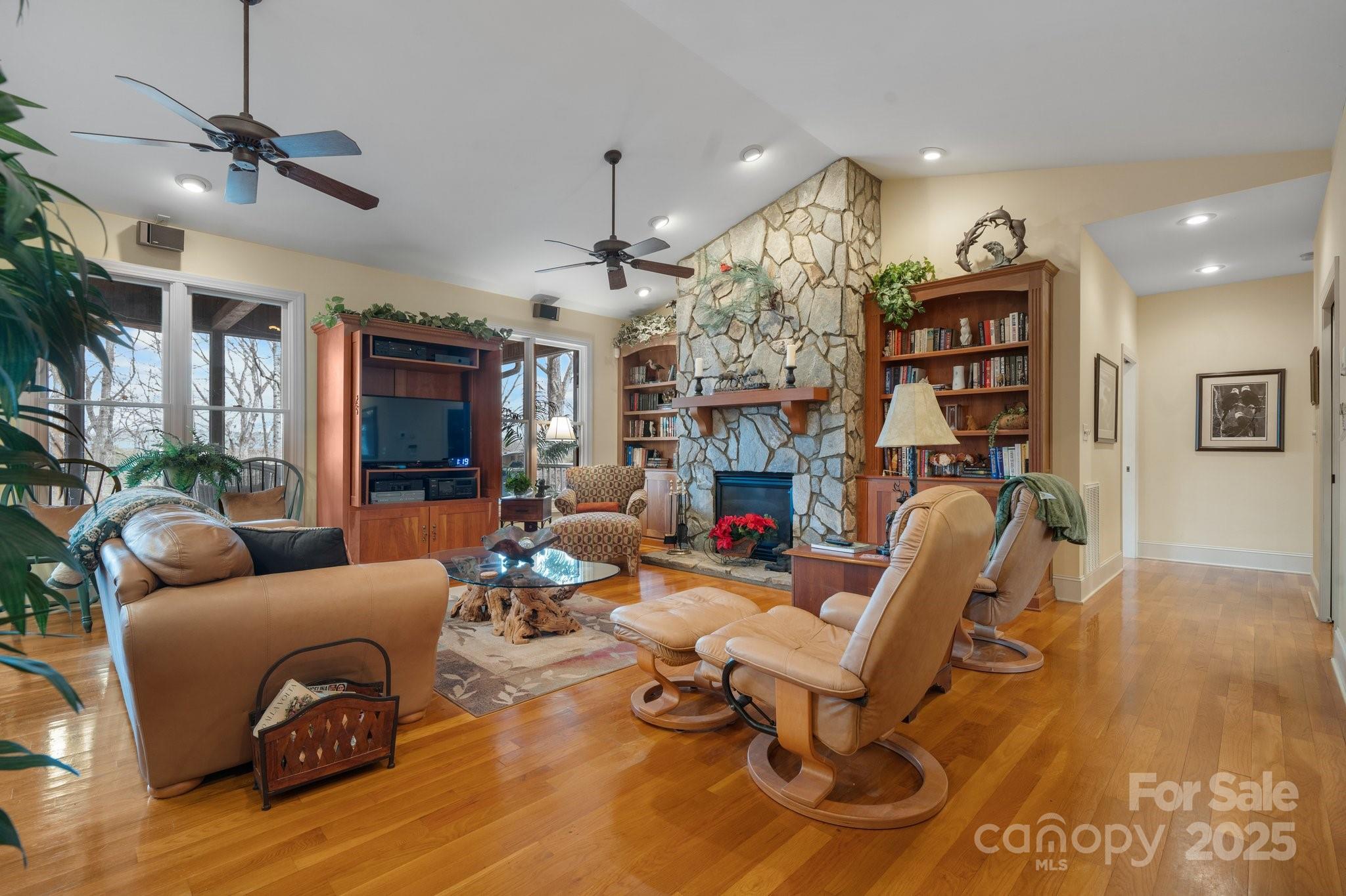4530 Meandering Way Conover, NC 28613 - Photo 10 of 48 a living room with furniture a fireplace and a flat screen tv