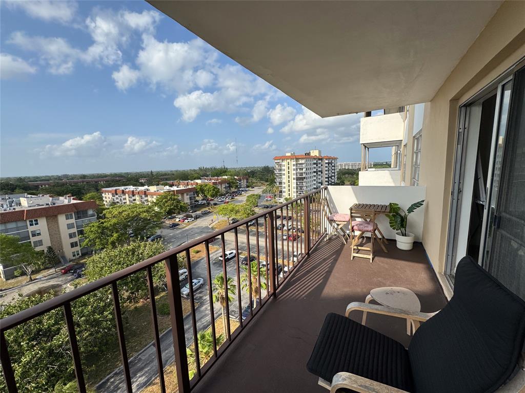 a view of a balcony with furniture