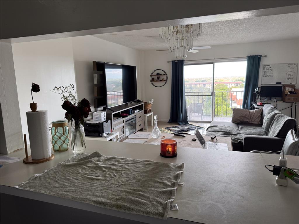 4174 Inverrary Drive, Unit 905 Lauderhill, FL 33319 - Photo 10 of 23 a living room with furniture hard wood floor and a floor to ceiling window