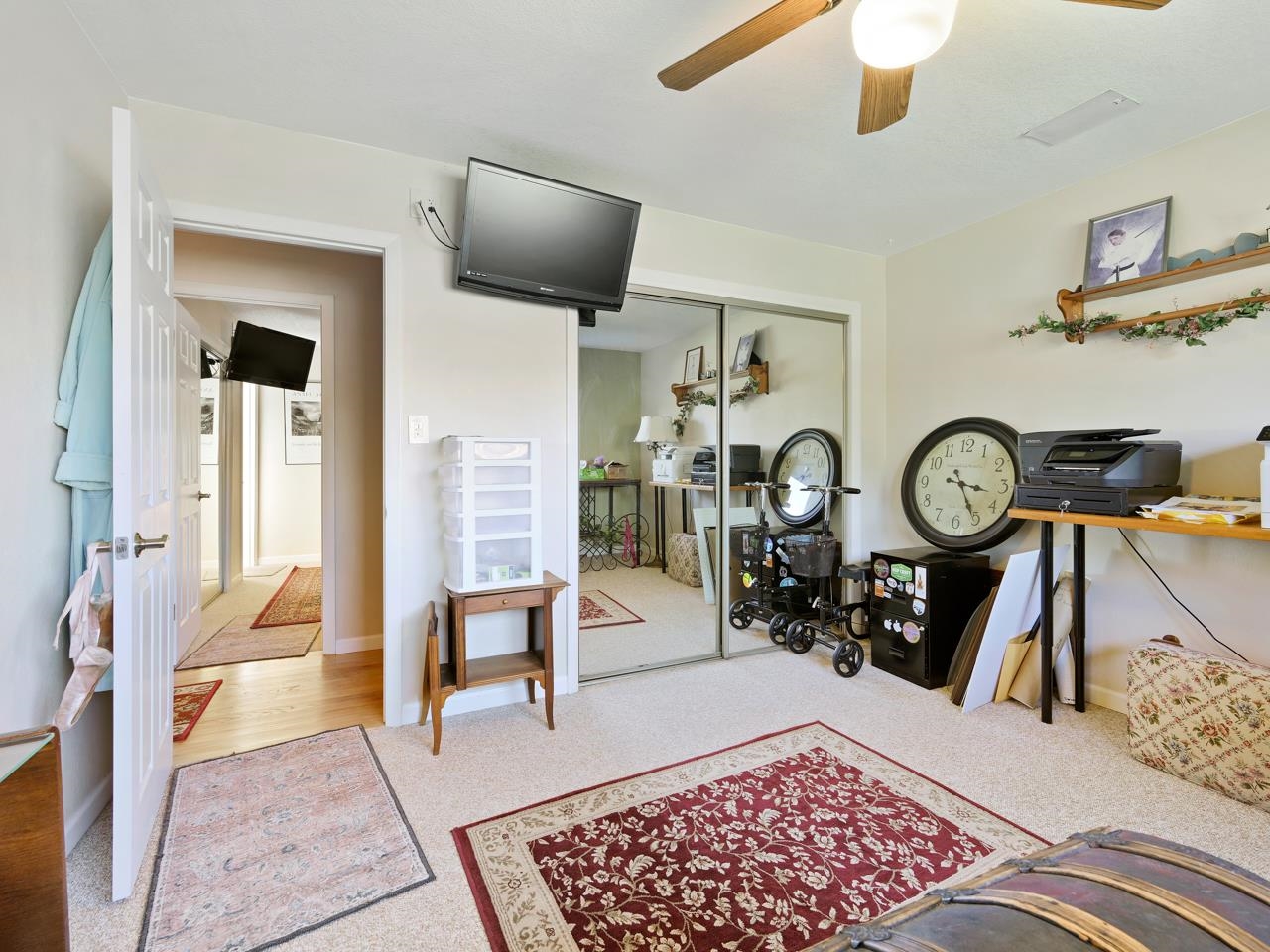 3697 F Road Palisade, CO 81526 - Photo 11 of 40 a view of a hallway with wooden floor and a chandelier