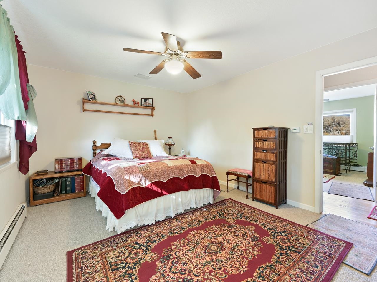 3697 F Road Palisade, CO 81526 - Photo 16 of 40 a bedroom with a bed and wooden floor