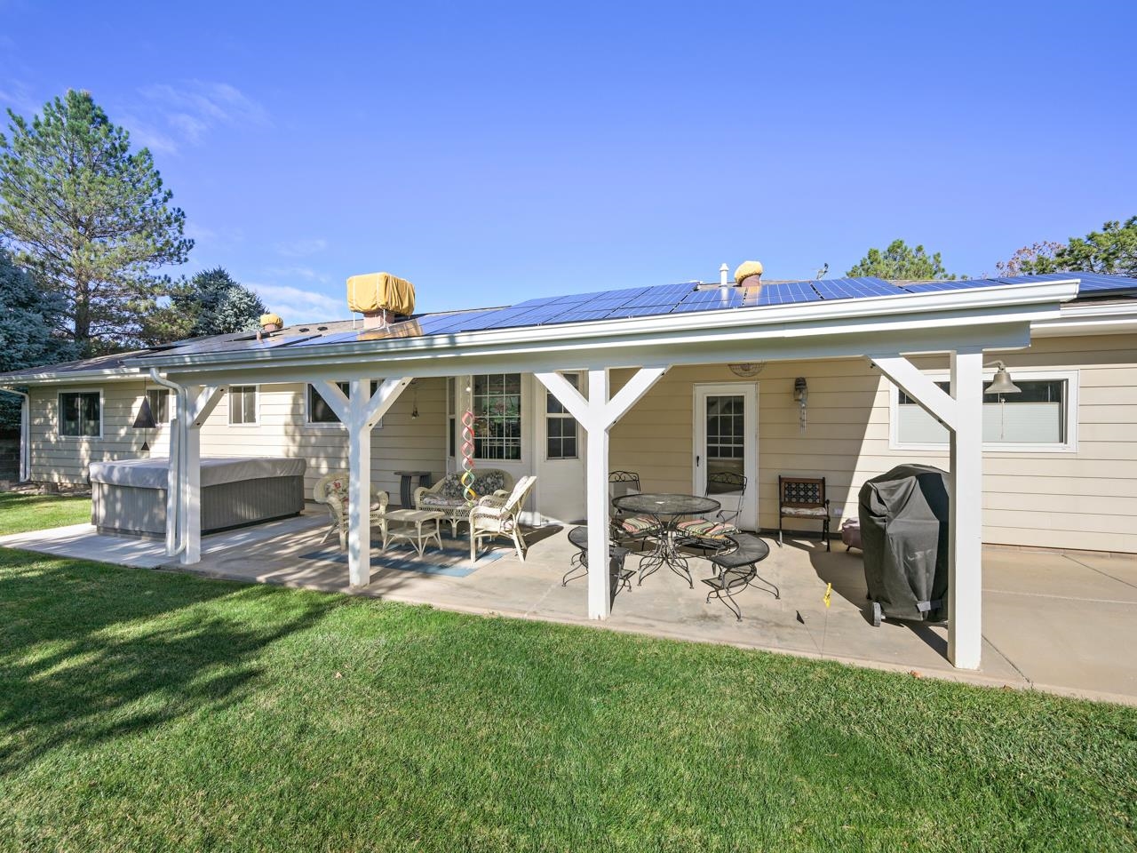3697 F Road Palisade, CO 81526 - Photo 20 of 40 a view of a house with patio furniture and garden