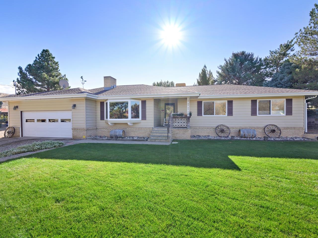 3697 F Road Palisade, CO 81526 - Photo 2 of 40 a front view of a house with a yard