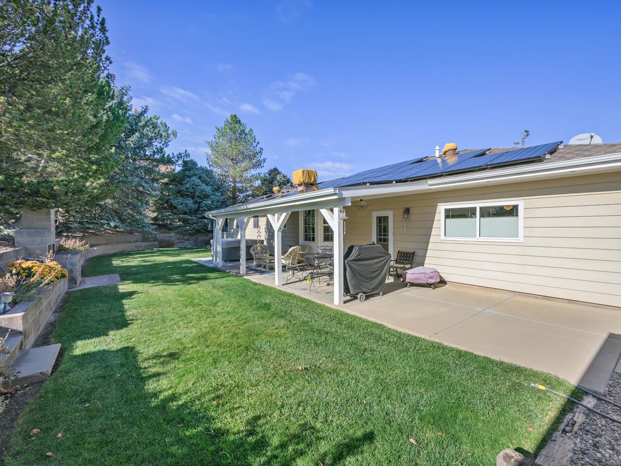 3697 F Road Palisade, CO 81526 - Photo 21 of 40 a view of a house with backyard porch and garden