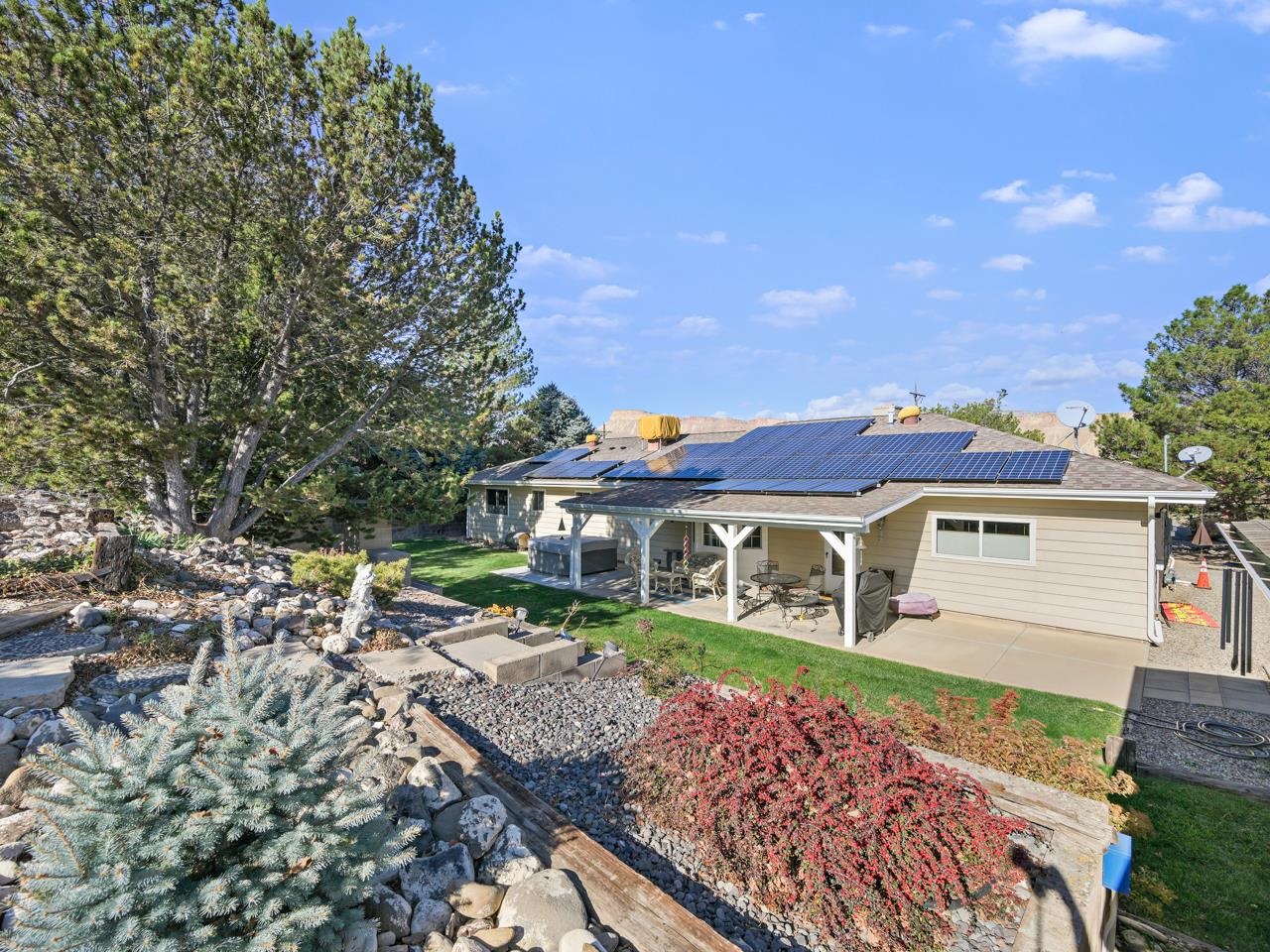 3697 F Road Palisade, CO 81526 - Photo 25 of 40 a view of a house with a yard and sitting area