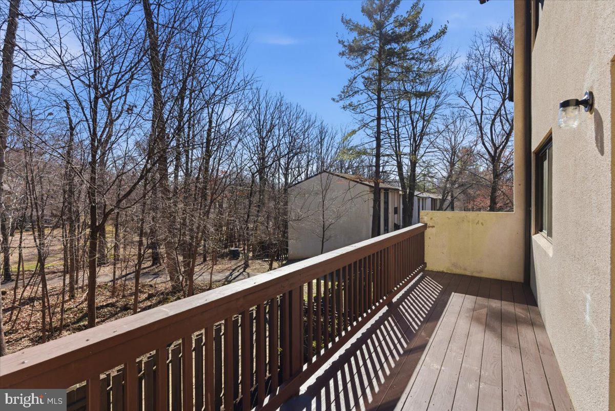 11919 Barrel Cooper Court Reston, VA 20191 - Photo 13 of 39 a view of a balcony with wooden floor and fence