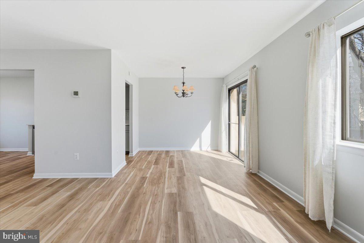 11919 Barrel Cooper Court Reston, VA 20191 - Photo 16 of 39 a view of a bedroom with wooden floor