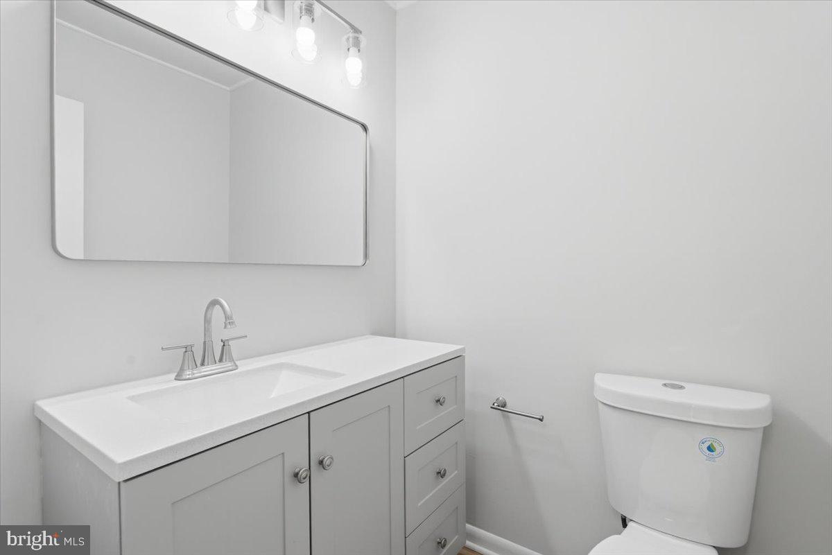 11919 Barrel Cooper Court Reston, VA 20191 - Photo 17 of 39 a bathroom with a sink a toilet and a mirror