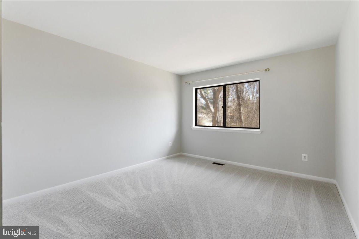 11919 Barrel Cooper Court Reston, VA 20191 - Photo 21 of 39 an empty room with a window