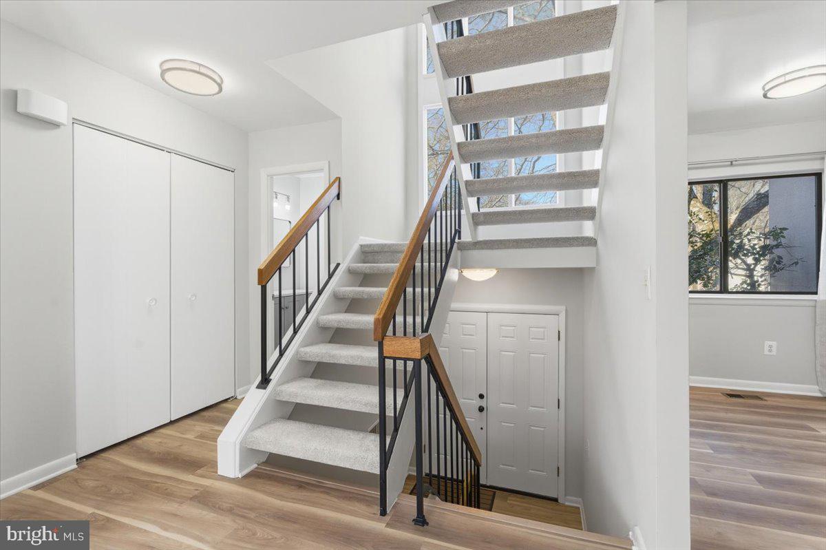 11919 Barrel Cooper Court Reston, VA 20191 - Photo 5 of 39 a view of staircase with wooden floor and white walls
