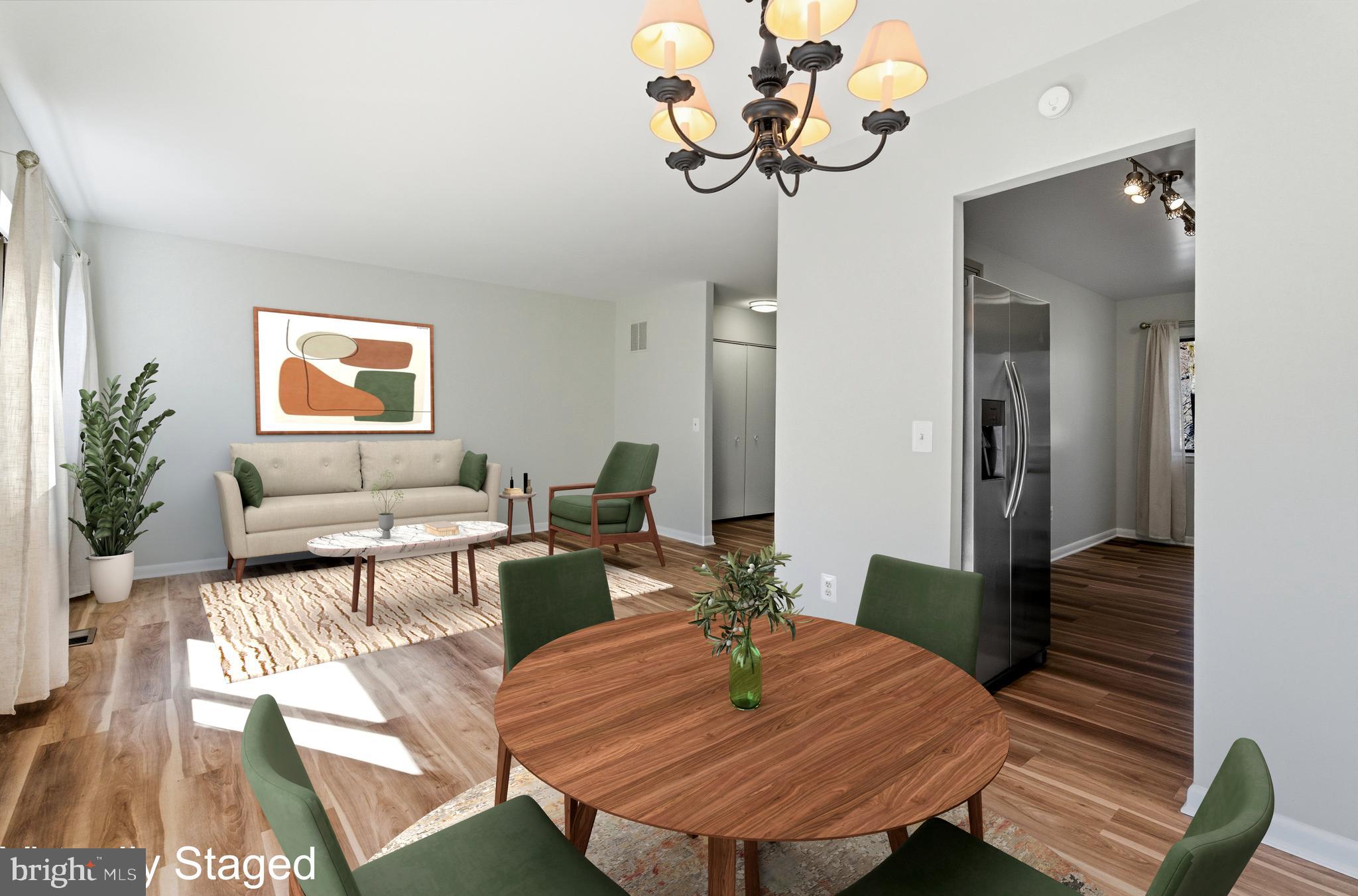 11919 Barrel Cooper Court Reston, VA 20191 - Photo 10 of 39 a living room with furniture dining table and a fireplace