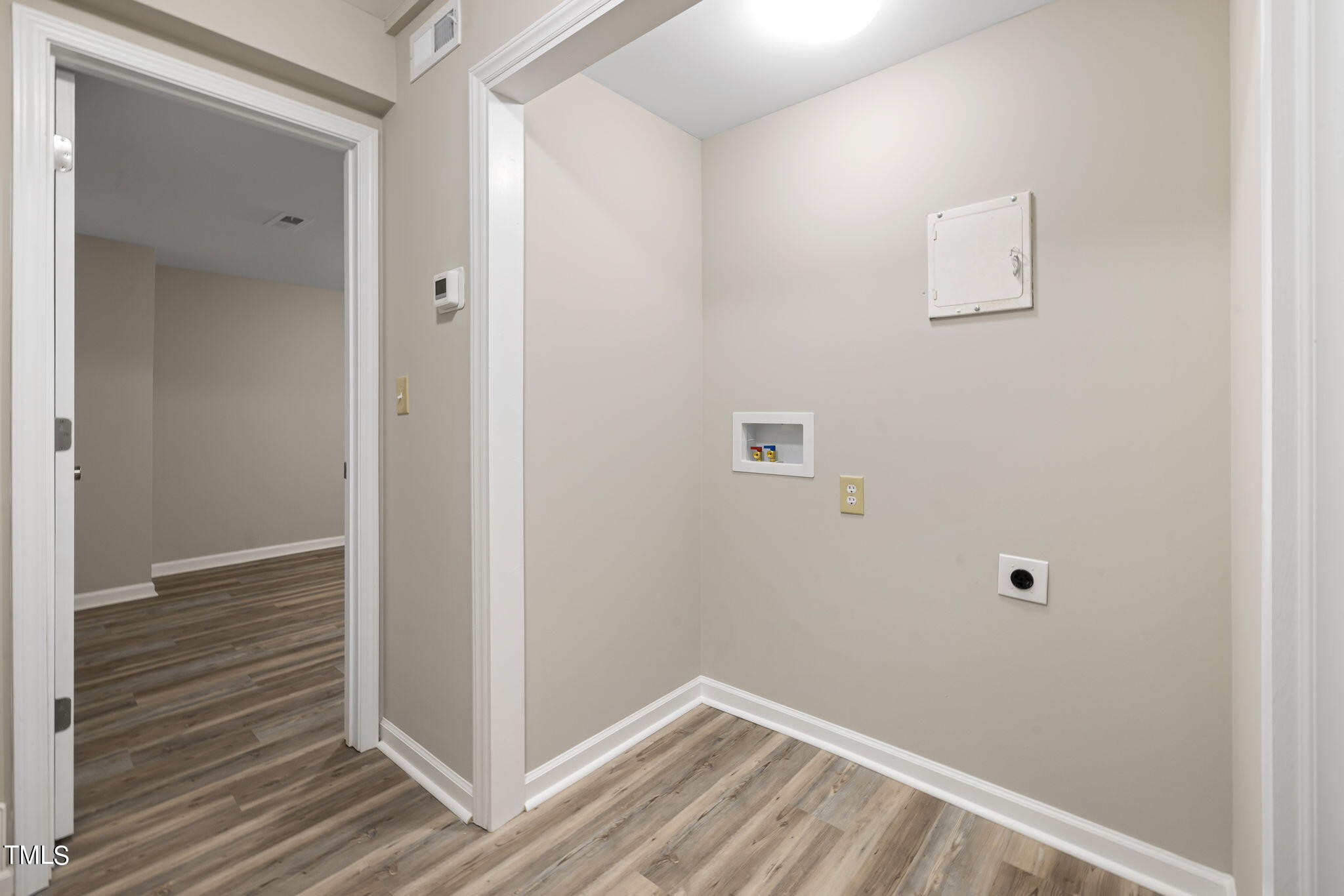 1728 Quail Ridge Road Raleigh, NC 27609 - Photo 29 of 38 a view of a hallway with wooden floor