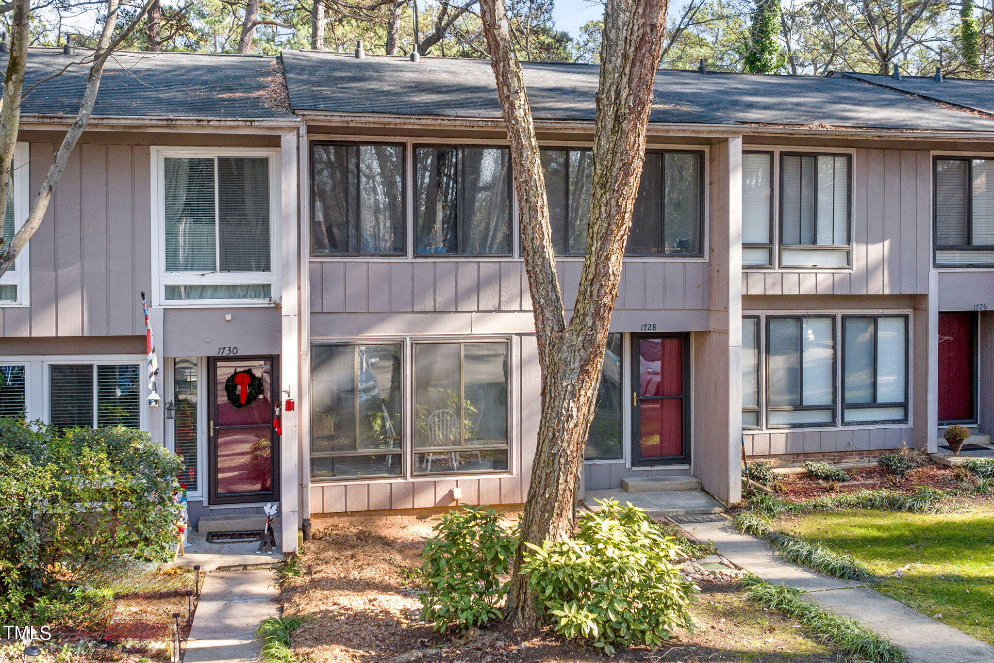 1728 Quail Ridge Road Raleigh, NC 27609 - Photo 3 of 38 a front view of a house with a yard