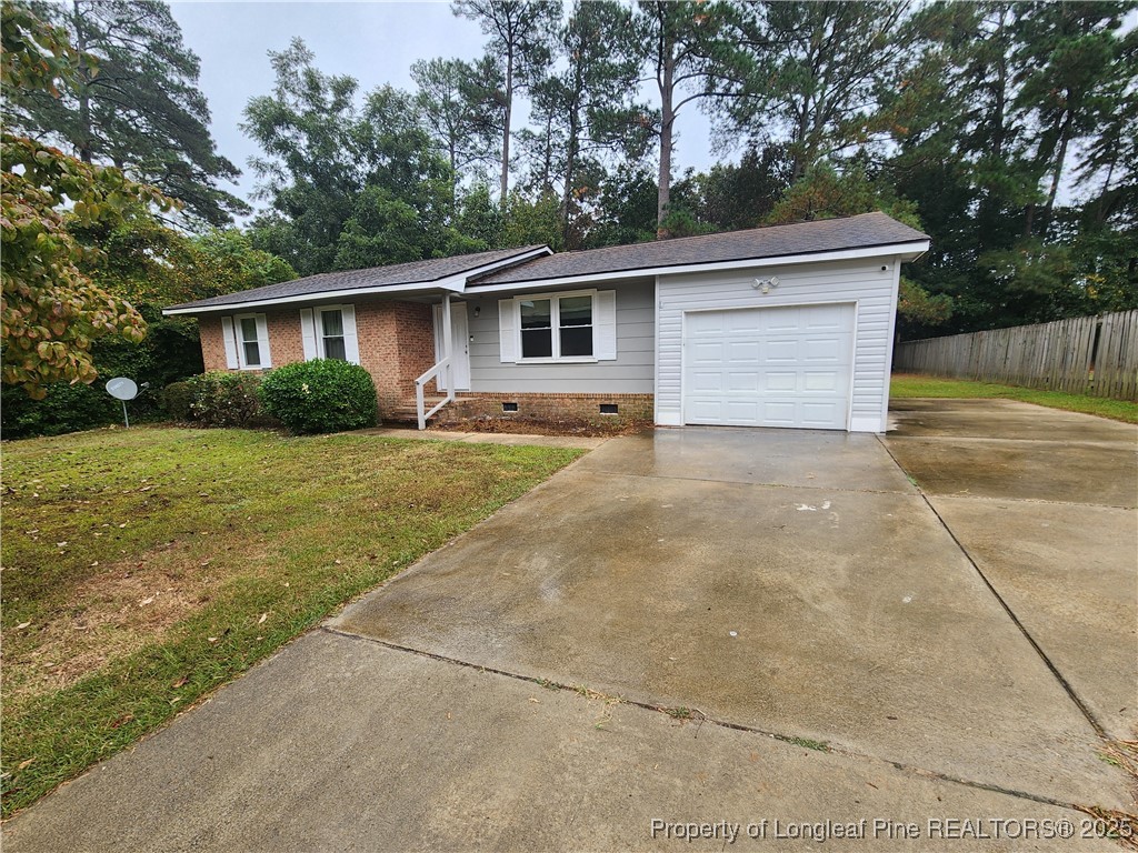 a front view of house with yard and trees