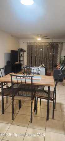 a living room with couches a coffee table and chairs