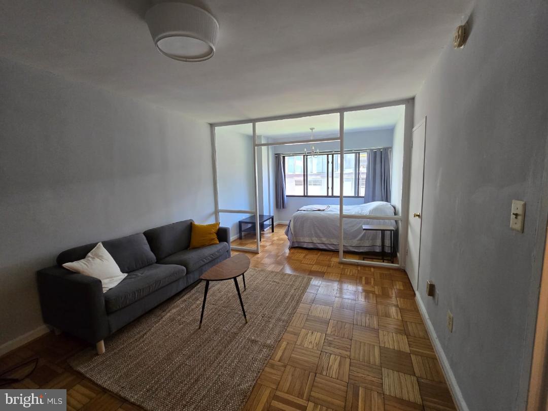 a living room with furniture and a rug