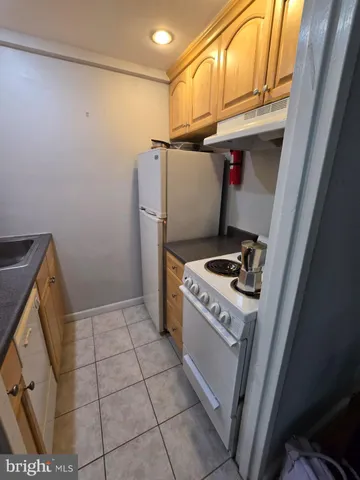 a view of a pathway with a wrought fence