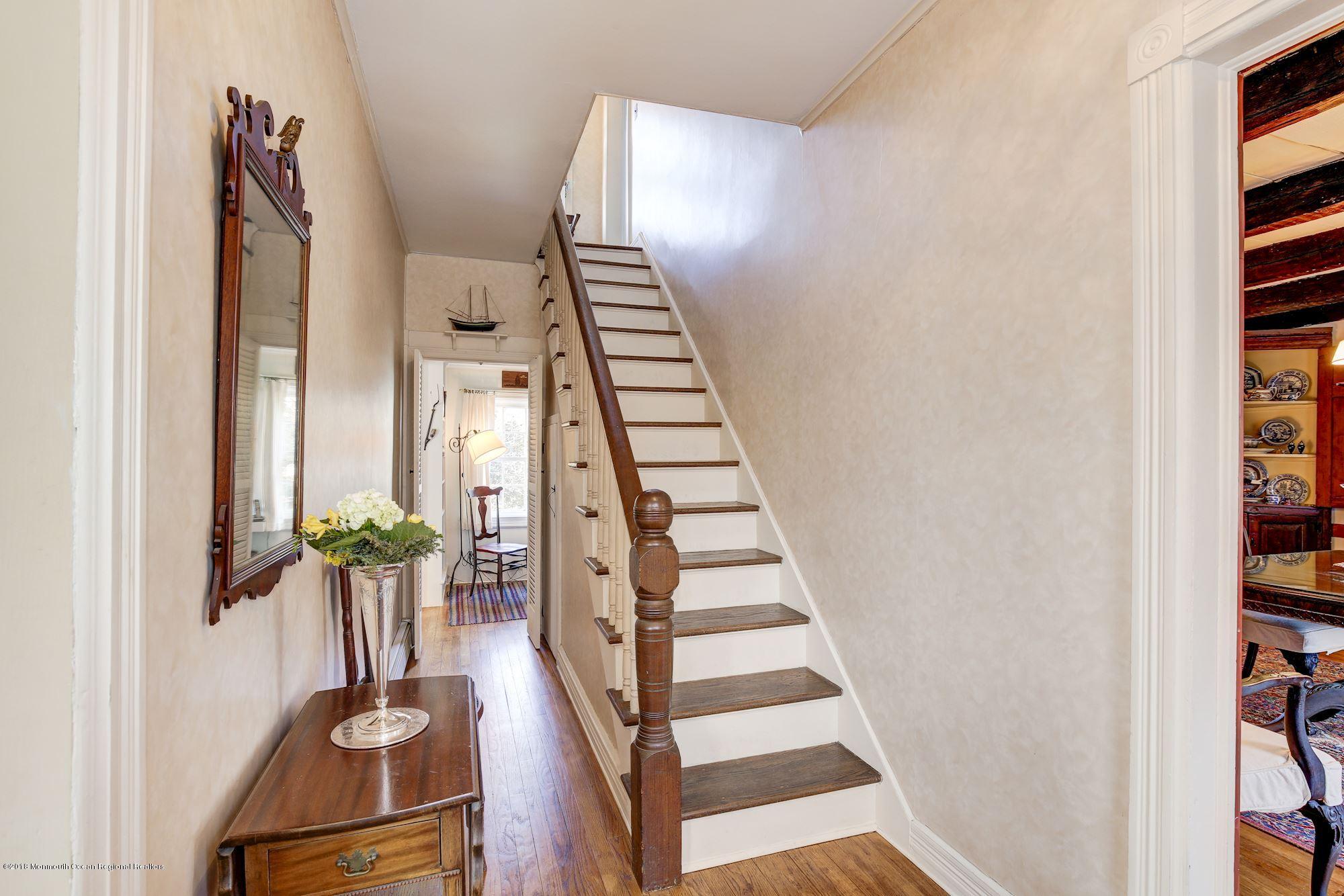 19 Tilton Road Middletown, NJ 07748 - Photo 2 of 26 a view of staircase with wooden floor and stairs