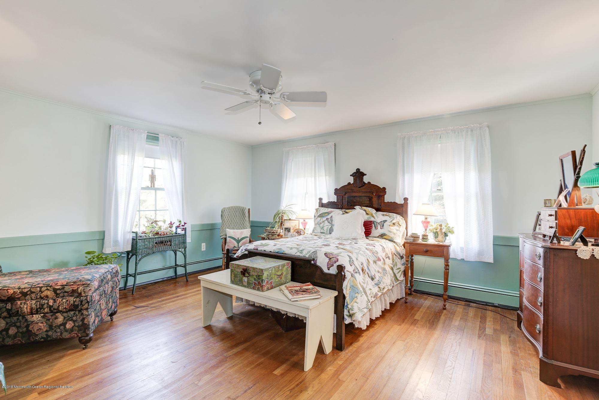 19 Tilton Road Middletown, NJ 07748 - Photo 17 of 26 a bed room with a bed and a couch