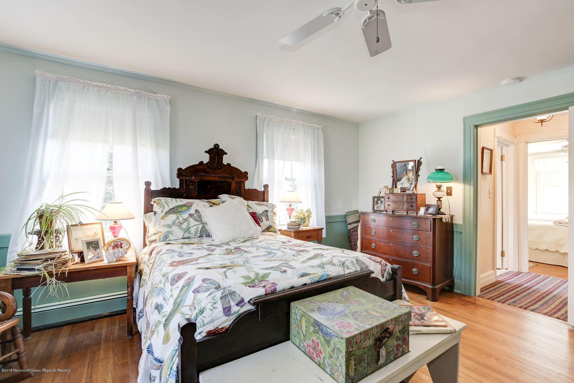 19 Tilton Road Middletown, NJ 07748 - Photo 18 of 26 a bed room with a bed and a dresser