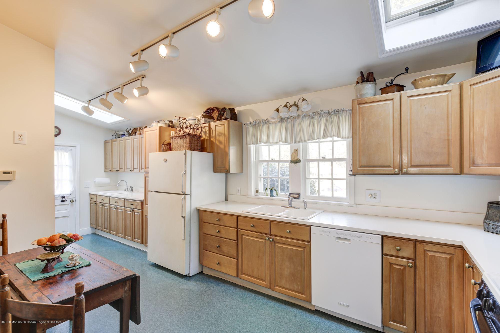 19 Tilton Road Middletown, NJ 07748 - Photo 8 of 26 a kitchen with a sink appliances and cabinets