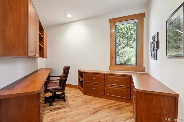 a room with a chair and a window