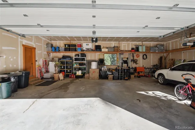 a view of parking garage with cars