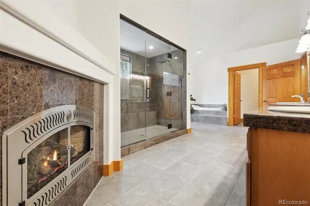 a bathroom with a sink a mirror and a bathtub