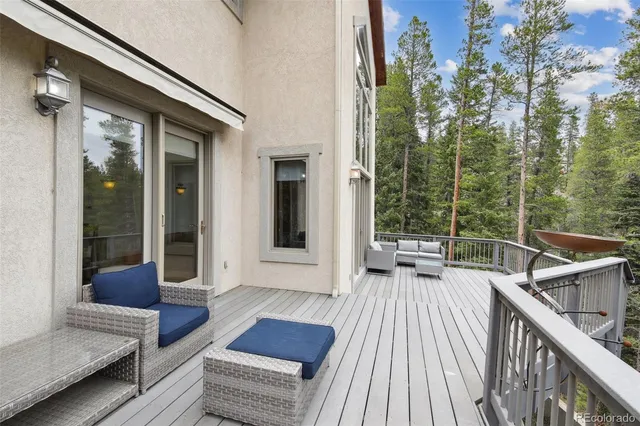a view of balcony with couch and wooden floor