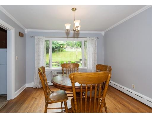 60 Palmer Road Monson, MA 01057 - Photo 25 of 40 a dining room with furniture a chandelier and wooden floor