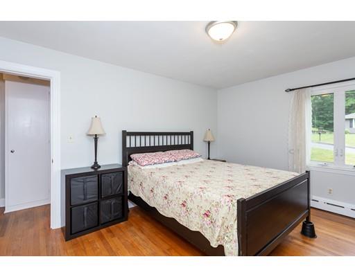 60 Palmer Road Monson, MA 01057 - Photo 35 of 40 a bedroom with a bed and a table