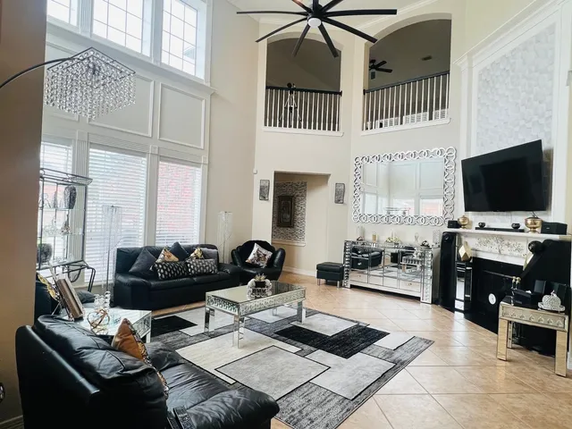 a bedroom with a bed wooden floor and window