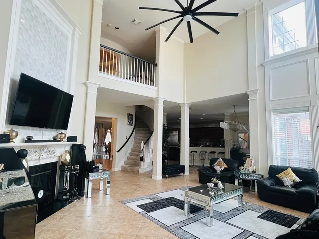 a swimming pool with an outdoor space and seating area