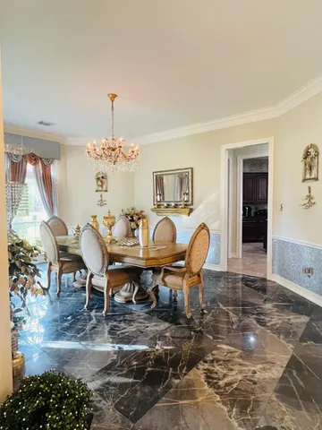 a view of living room with furniture and a chandelier