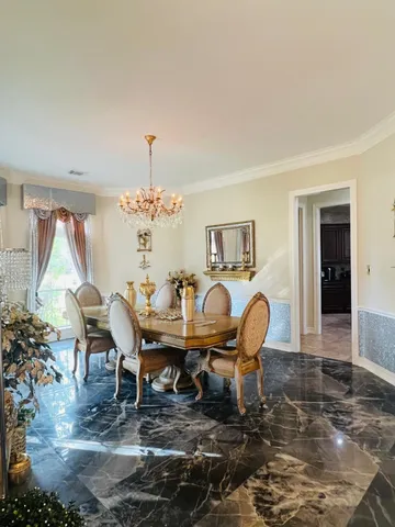a view of a hallway with wooden floor and a fireplace
