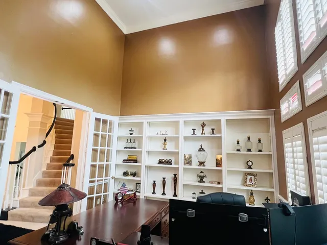 a living room with furniture fireplace and a table