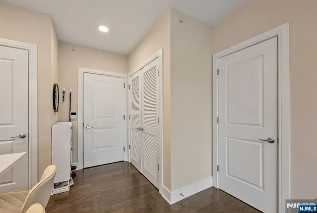 a kitchen with stainless steel appliances granite countertop a stove a refrigerator a oven a sink with a dining table and chairs