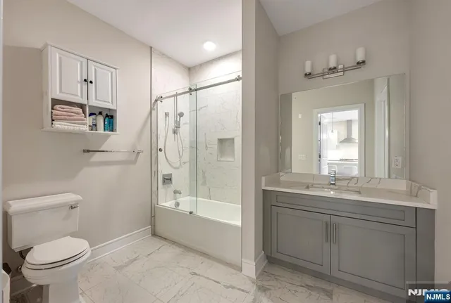 a stove top oven sitting inside of a kitchen